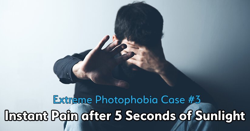 Man with extreme photophobia covering his eyes from bright outdoor light
